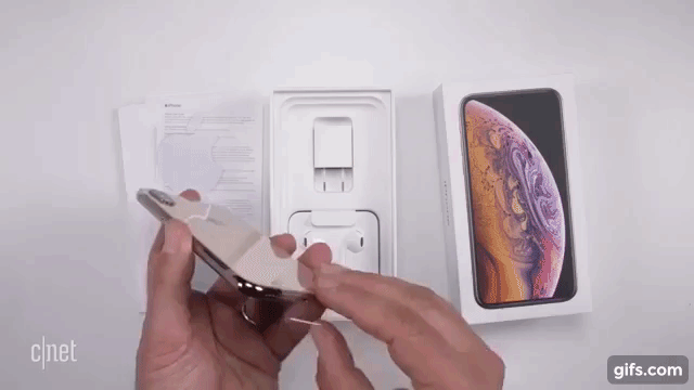 Unboxing the gold iPhone XS animated gif.gif