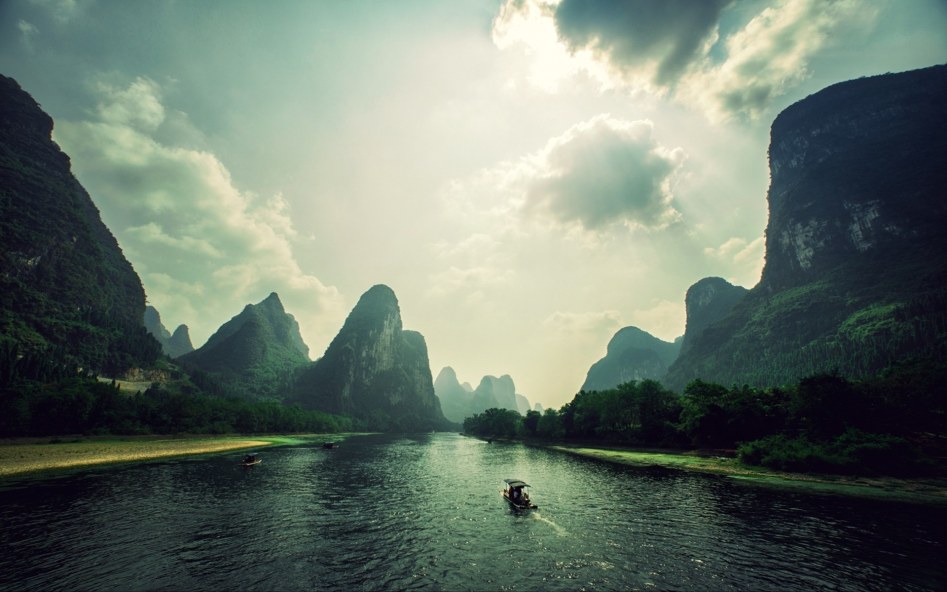 Mountains-clouds-rocks-river-boat-Vietnam-landscape_1920x1200.jpg