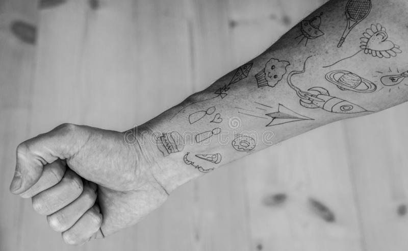 close-up-doodle-tattoos-forearm-140598447.jpg